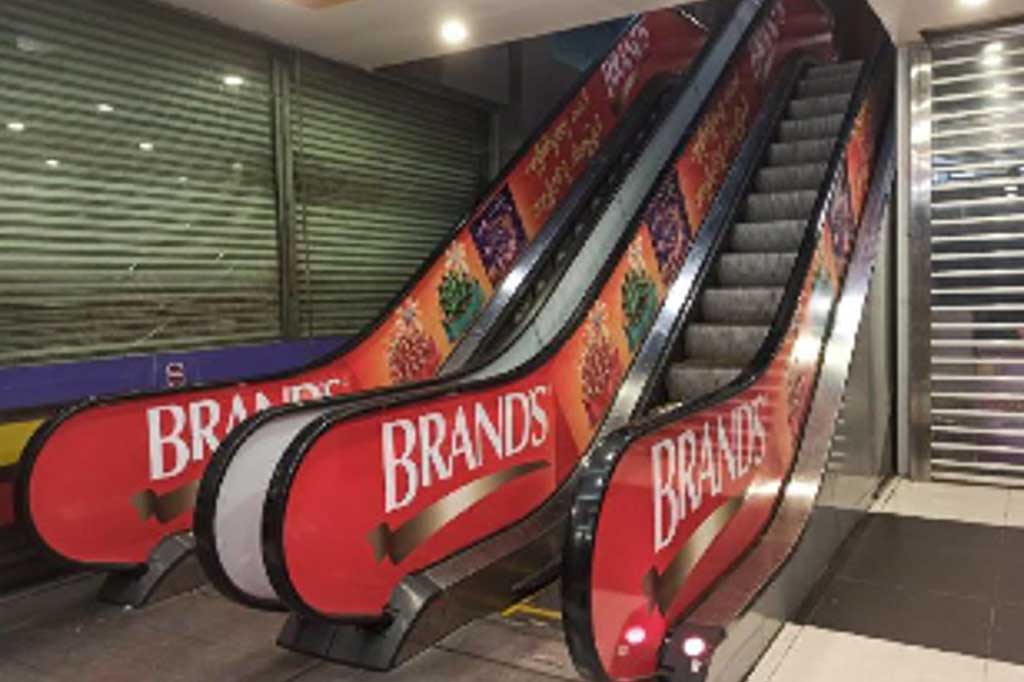 BRAND’S Escalator Advertising